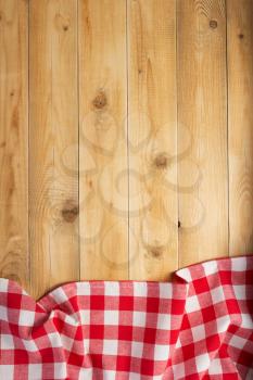 cloth napkin at rustic wooden plank board table background, top view