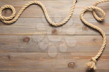 ship rope at wooden background texture, top veiw