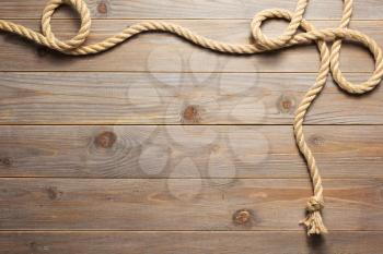 ship rope at wooden background texture, top veiw