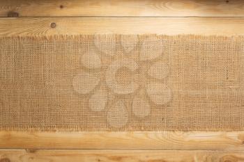 burlap hessian sacking on wooden plank board background
