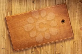 cutting board or tray at wooden background texture, top view