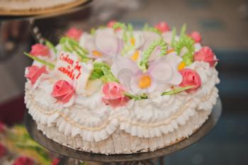 Beautiful pie with flowers from cream.