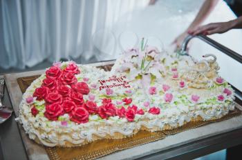 Process of cutting of wedding cake.