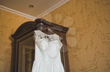 White dress on a hanger.