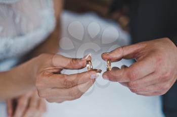 Hands with wedding rings.