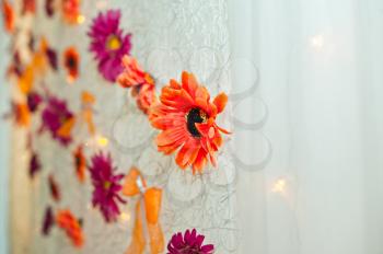 The curtain decorated with flowers.