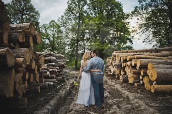 Walk of a newly-married couple about logs.