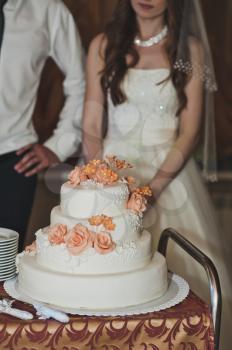 The couple share the cake for guests.