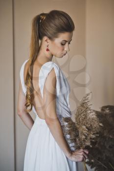 White dress with open back.