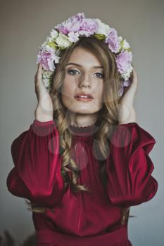 Girl with a wreath of flowers.