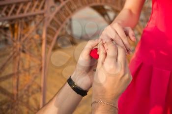 The man proposes marriage hands and hearts to the girl.