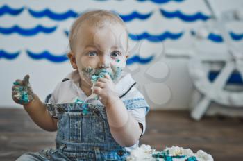 Portrait of a child covered in cake.