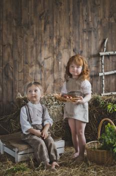 Portrait of children playing with Easter eggs.