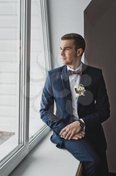 Portrait of a young man in a smart suit.