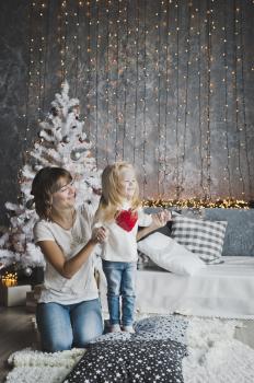 Family games around the Christmas tree.