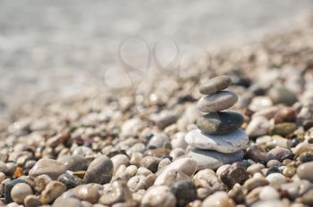 The pyramid of pebbles on the beach.