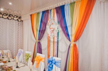 Decorated with rainbow ribbons and fabrics Banquet hall.