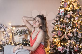 The girl with her long hair in Christmas decorations.