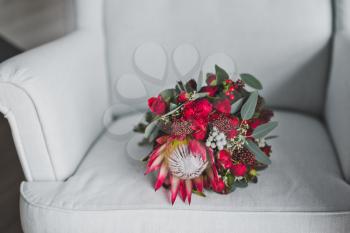 Beautiful bouquet on a white chair.