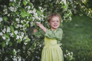 The little girl in the flowered garden.