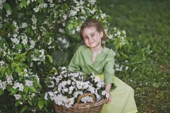 Portrait of a girl in a spring garden.