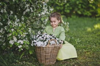 Portrait of a girl in a spring garden.