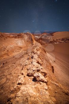 night sky. Amphitheatre is beautiful geological formation of Moon Valley in Atacama Desert, Chile