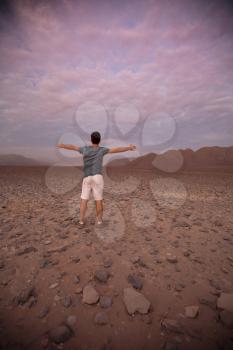 People in the Nazca desert is at sunset. Peru.
