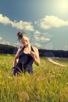 Girl in Pin up in a field enjoying life