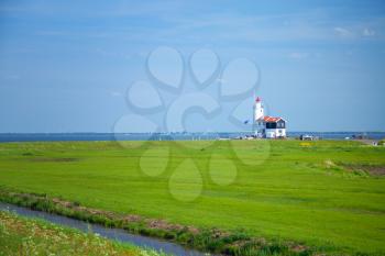 lighthouse in Marken is on the coast of the Sea in Europe