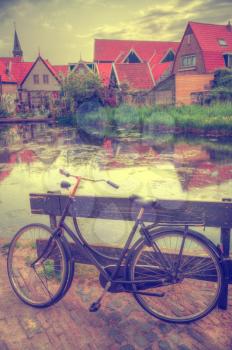 Vintage Dutch town of Volendam European evening. Retro style. houses and bikes on the street in the summer