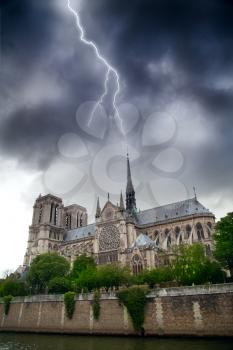 during a summer thunderstorm lightning strikes directly at Notre Dame de Paris. mystical Paris, France.