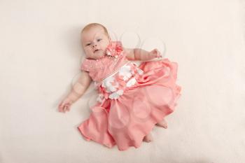 3 months baby girl in a pink dress