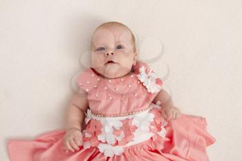 3 months baby girl in a pink dress