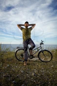 man on a bicycle near the sea. Travel and Recreation summer