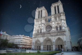 sunset Notre Dame de Paris. France. Europe. At night the stars shine and the moon.