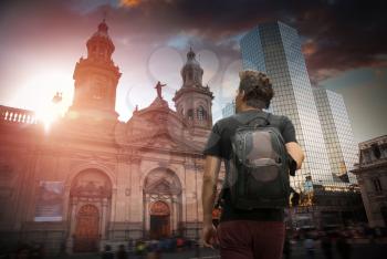 A traveler with a backpack. Plaza de las Armas square in Santiago, Chile