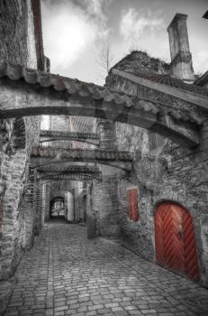 St. Catherine's Passage in Tallinn, Estonia. medieval city in Europe. black and red and white photo