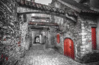 St. Catherine's Passage in Tallinn, Estonia. medieval city in Europe. black and red and white photo