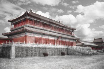 The Forbidden City is the largest palace complex in the world. black and red and white photo