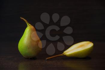 Mature juicy beautiful pear on the table