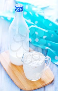 kefir in glass jug and on a table