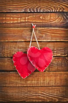 red hearts on the wooden table, heart background