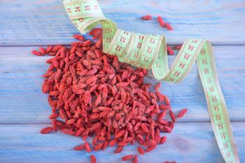 dry goji berries on the wooden table