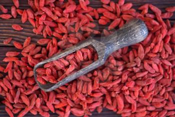 dry red berries, dry goji berries on a table