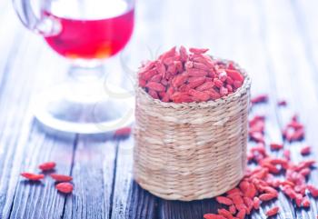 dry red berries, dry goji berries on a table