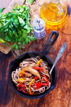 soba with meat and vegetables in the pan