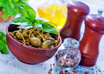 capers with pepper and salt in the bowl