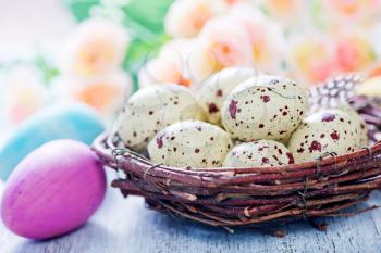 decorative painted Easter eggs on a table, easter background