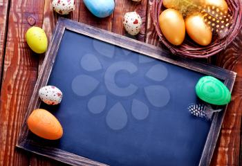 color easter eggs on a table, easter background